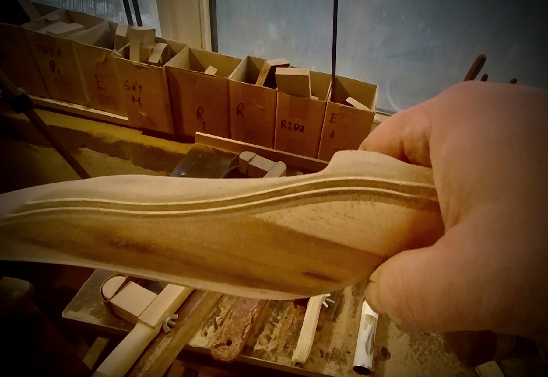 Sculptural handcrafted bow grip detail